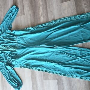 Ashley Stewart Teal Outfit with Elegant Detailing